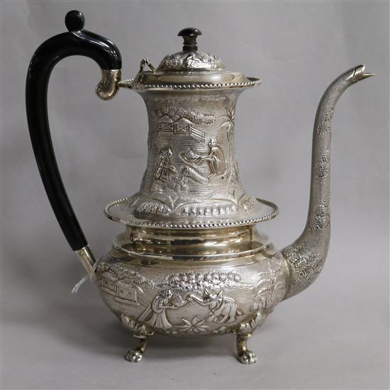 An Indian embossed white metal coffee pot, gross 35.5 oz.